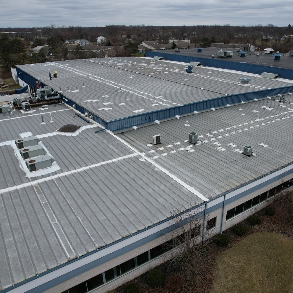 Premier National Roofing team on-site during commercial roofing project