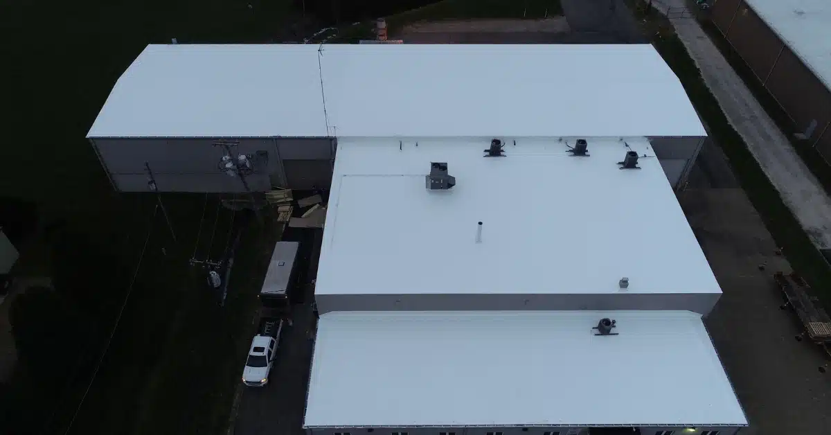 Restored commercial roof with fresh fluid-applied coating by Premier National Roofing for improved durability and waterproofing