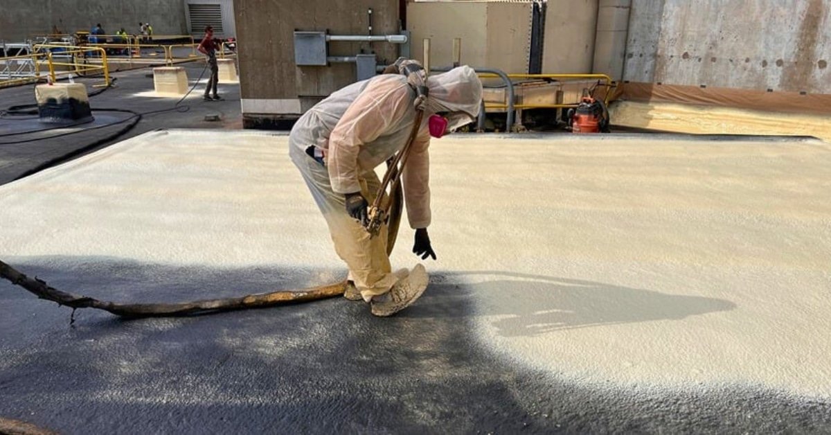 SPF roof coating sprayed on commercial building for insulation and leak prevention